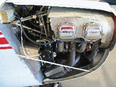 ADC filter mounted on firewall slightly left and below center of photo with 2 hoses running into the top of the black square box and white sensor wires running out and up to the instrument panel warning lights Cowl Open Right Side.JPG